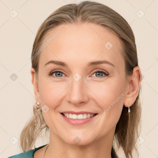 Joyful white young-adult female with medium  brown hair and blue eyes