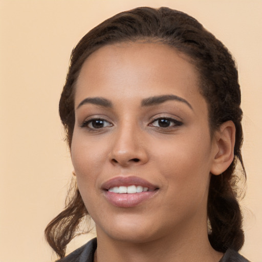 Joyful white young-adult female with long  brown hair and brown eyes