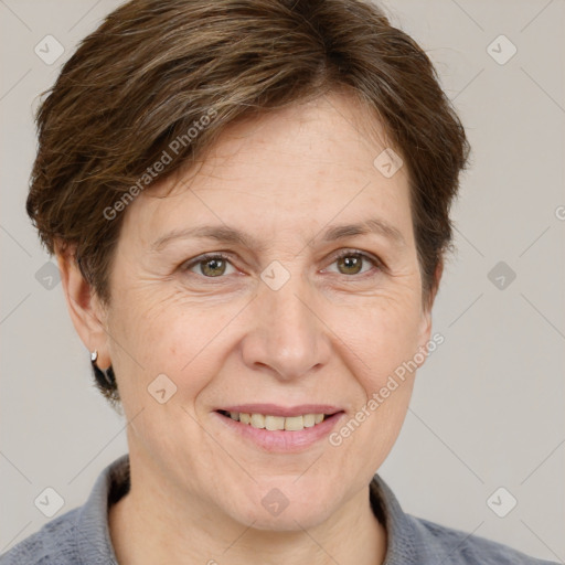 Joyful white adult female with short  brown hair and grey eyes