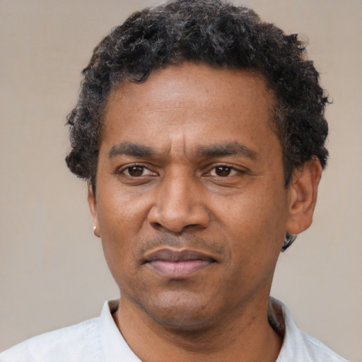 Neutral latino adult male with short  black hair and brown eyes