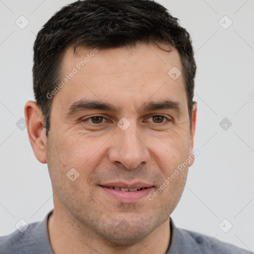 Joyful white adult male with short  brown hair and brown eyes