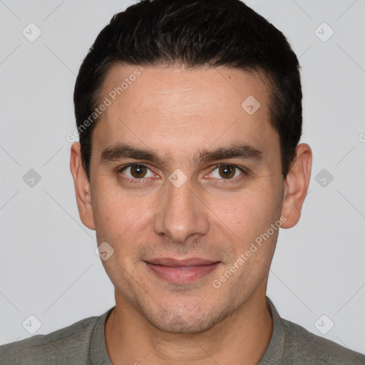 Joyful white young-adult male with short  black hair and brown eyes