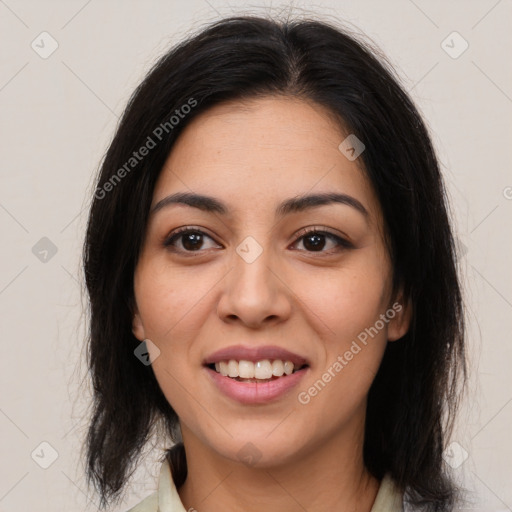 Joyful latino young-adult female with medium  brown hair and brown eyes