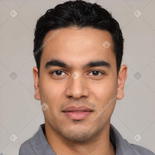 Joyful latino young-adult male with short  black hair and brown eyes