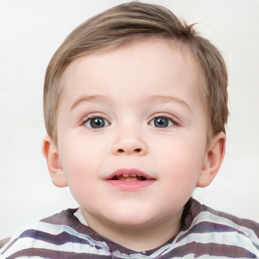 Joyful white child male with short  brown hair and blue eyes