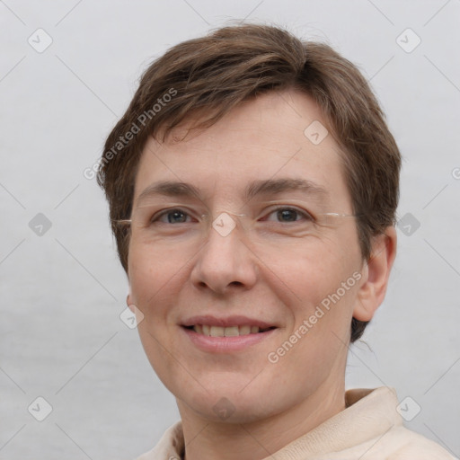 Joyful white adult female with short  brown hair and grey eyes