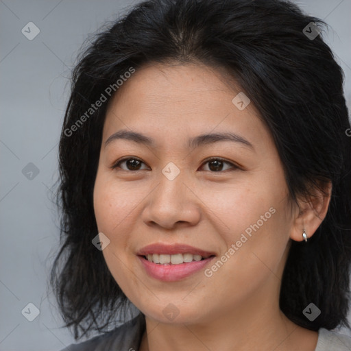 Joyful asian young-adult female with long  brown hair and brown eyes