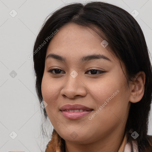 Joyful asian young-adult female with long  brown hair and brown eyes