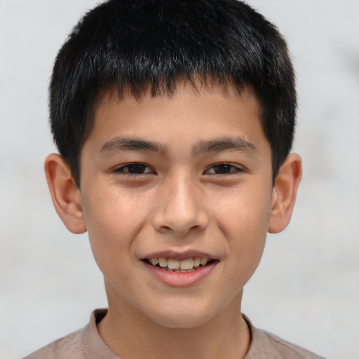 Joyful white child male with short  brown hair and brown eyes