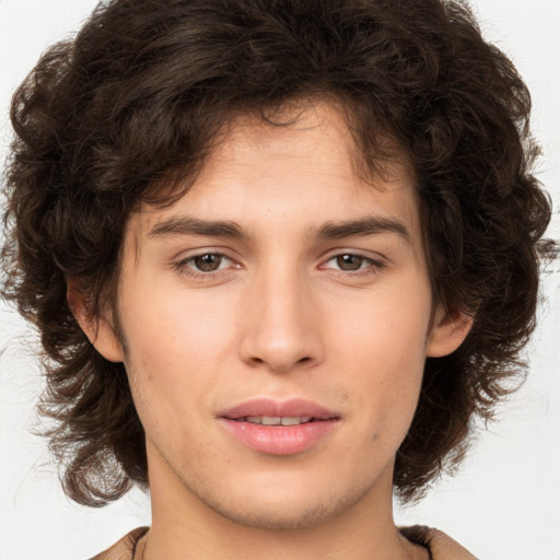 Joyful white young-adult male with medium  brown hair and brown eyes