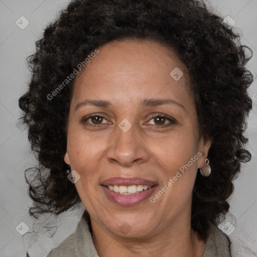 Joyful black adult female with medium  brown hair and brown eyes