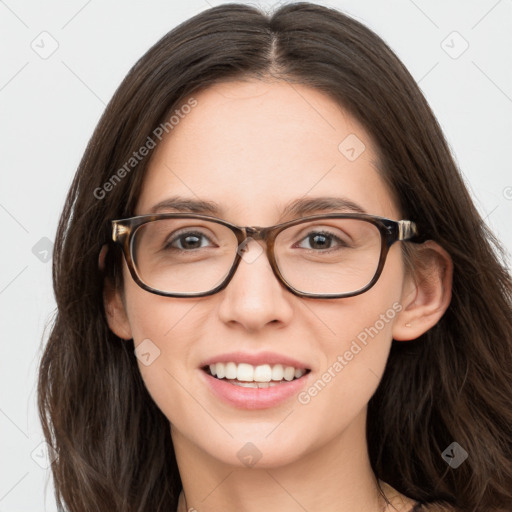 Joyful white young-adult female with long  brown hair and blue eyes