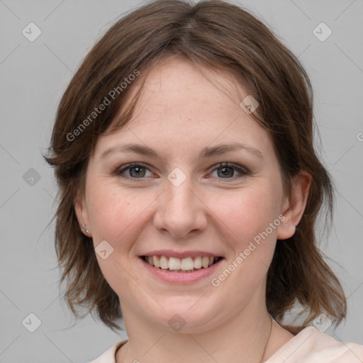 Joyful white young-adult female with medium  brown hair and grey eyes