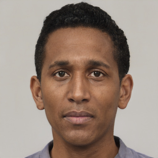 Neutral black young-adult male with short  black hair and brown eyes