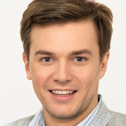 Joyful white young-adult male with short  brown hair and brown eyes