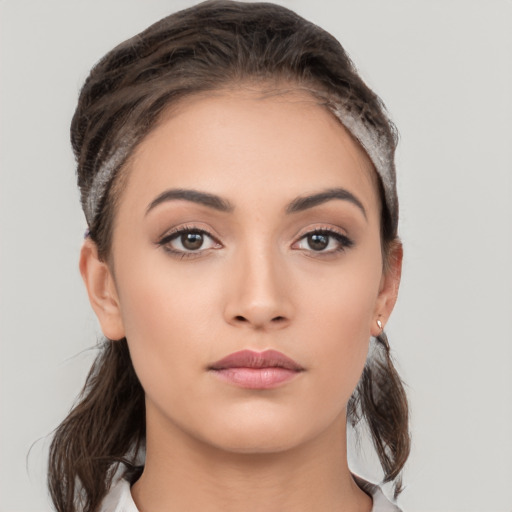 Neutral white young-adult female with medium  brown hair and brown eyes