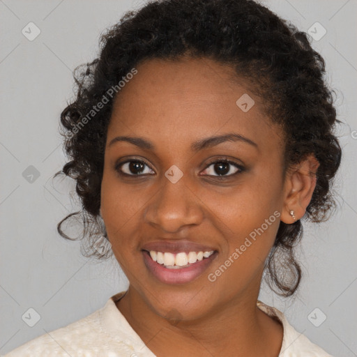 Joyful black young-adult female with medium  brown hair and brown eyes