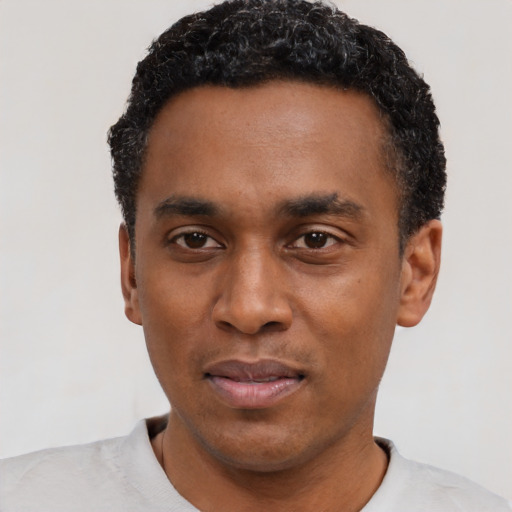 Neutral black young-adult male with short  black hair and brown eyes