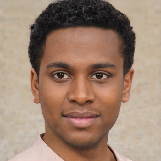Joyful latino young-adult male with short  brown hair and brown eyes