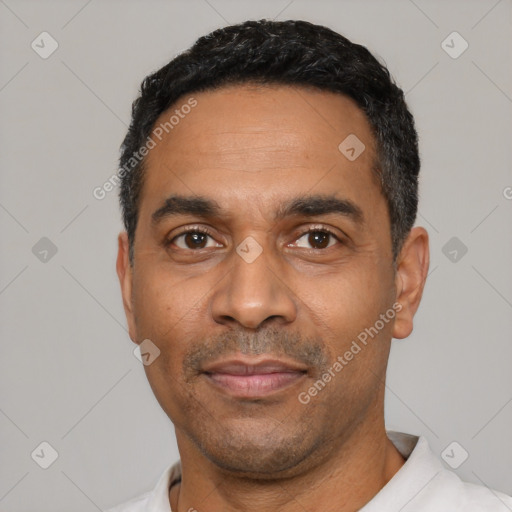 Neutral latino adult male with short  black hair and brown eyes