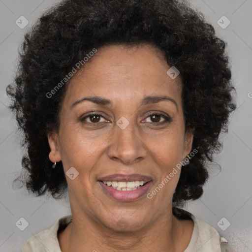 Joyful black adult female with medium  brown hair and brown eyes