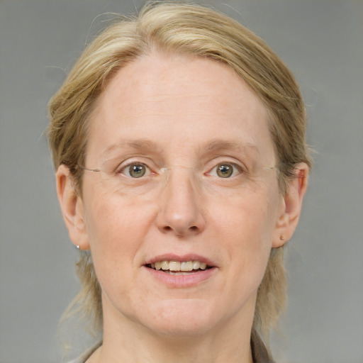 Joyful white adult female with medium  brown hair and blue eyes