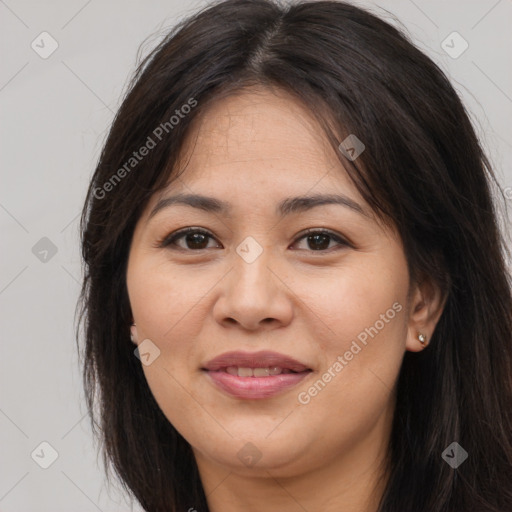 Joyful asian young-adult female with long  brown hair and brown eyes