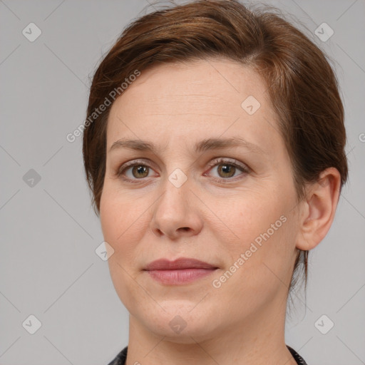 Joyful white adult female with medium  brown hair and grey eyes