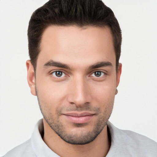 Joyful white young-adult male with short  brown hair and brown eyes