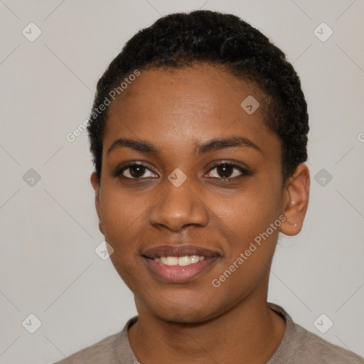 Joyful black young-adult female with short  black hair and brown eyes