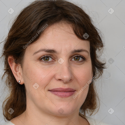 Joyful white adult female with medium  brown hair and grey eyes