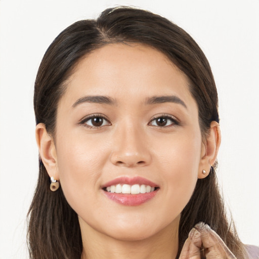 Joyful white young-adult female with long  brown hair and brown eyes