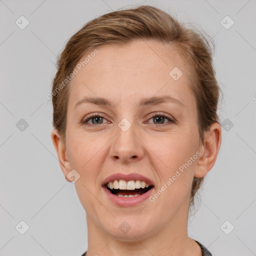 Joyful white young-adult female with short  brown hair and grey eyes