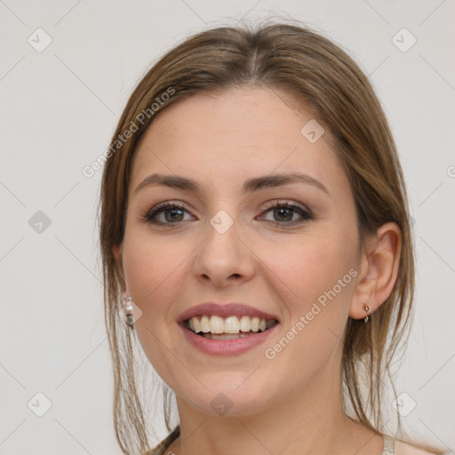 Joyful white young-adult female with medium  brown hair and grey eyes