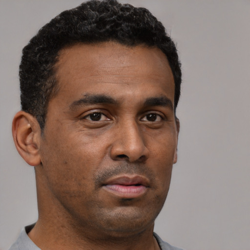 Neutral black young-adult male with short  brown hair and brown eyes