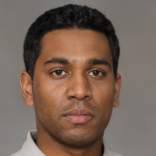 Neutral latino young-adult male with short  brown hair and brown eyes