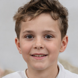 Joyful white child male with short  brown hair and brown eyes