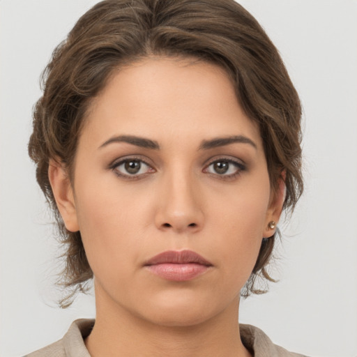 Neutral white young-adult female with medium  brown hair and brown eyes