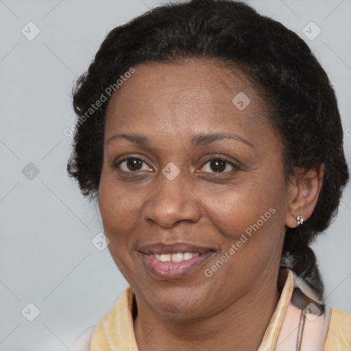 Joyful black adult female with short  brown hair and brown eyes