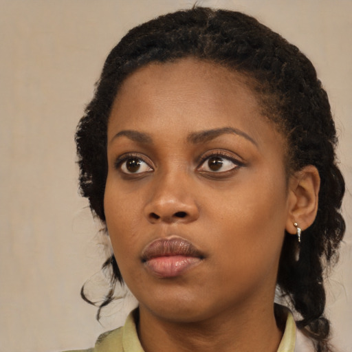 Neutral black young-adult female with medium  black hair and brown eyes
