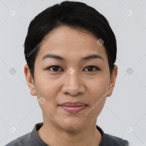 Joyful asian young-adult female with short  black hair and brown eyes