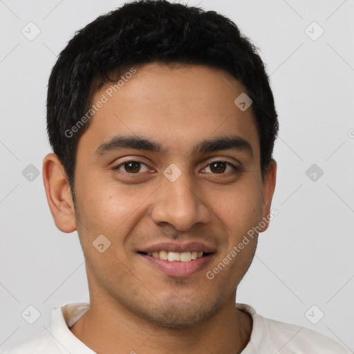 Joyful latino young-adult male with short  brown hair and brown eyes