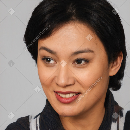 Joyful asian young-adult female with medium  black hair and brown eyes