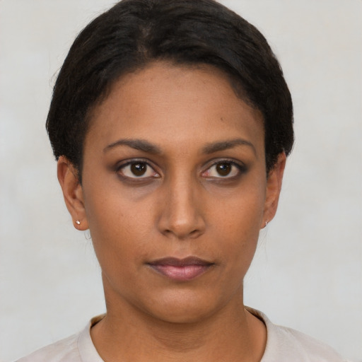 Neutral latino young-adult female with short  brown hair and brown eyes