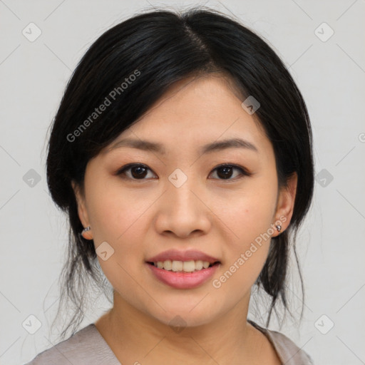 Joyful asian young-adult female with medium  black hair and brown eyes