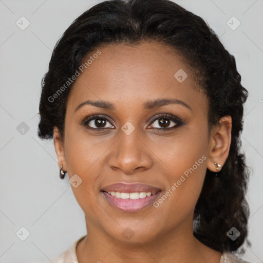 Joyful black young-adult female with short  brown hair and brown eyes