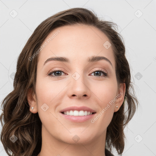 Joyful white young-adult female with medium  brown hair and grey eyes