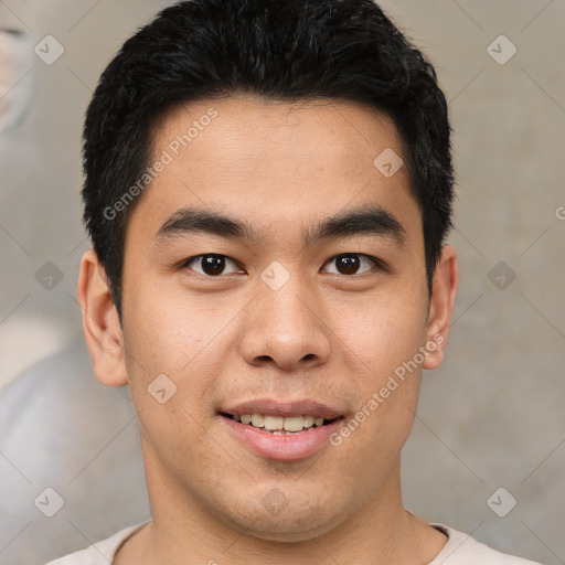 Joyful asian young-adult male with short  brown hair and brown eyes