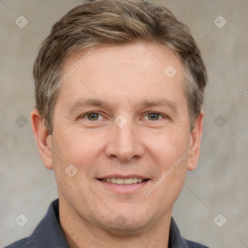 Joyful white adult male with short  brown hair and grey eyes