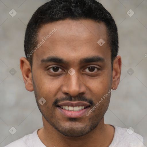 Joyful black young-adult male with short  black hair and brown eyes